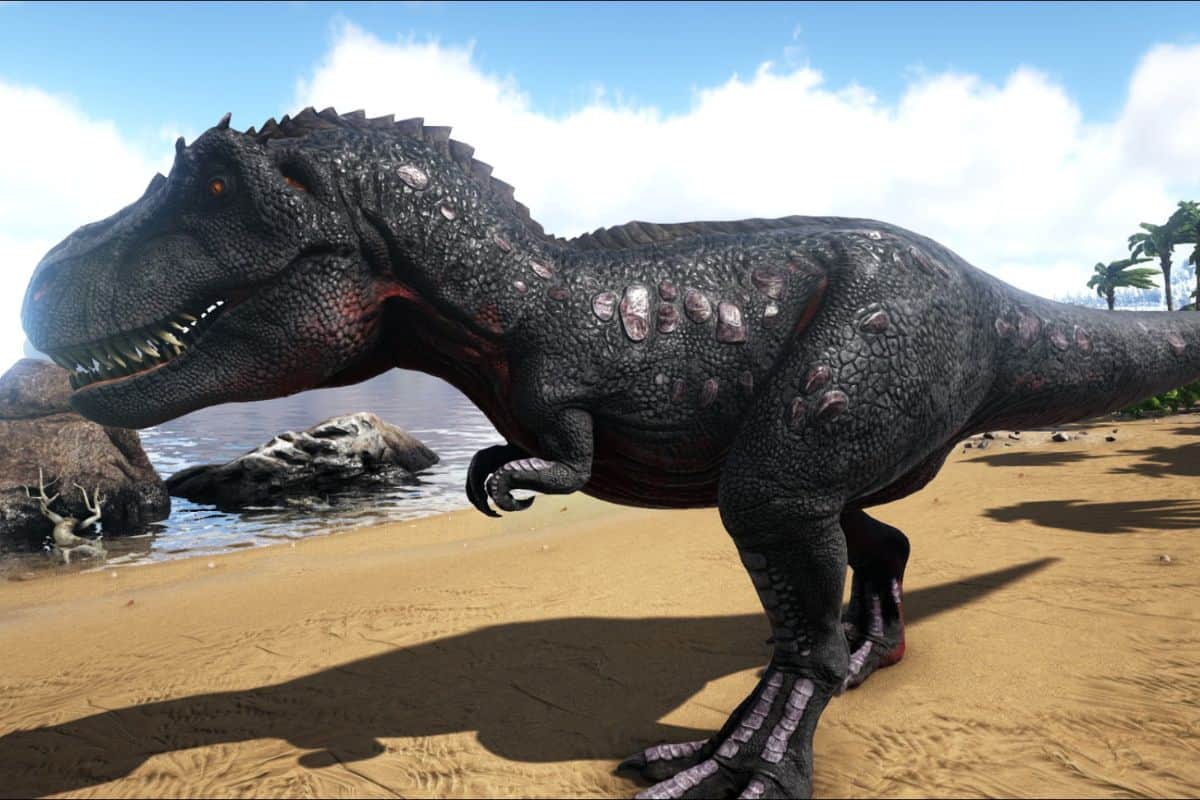 t rex on beach walking to water.